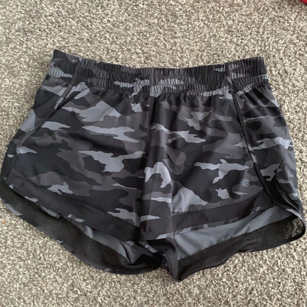Black camo Athleta Relay shirt size M. 4” inseam